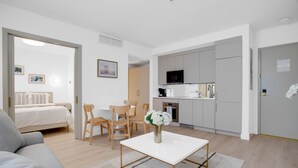 A modern apartment with a living room, dining area, and kitchen. - Vonder Miami Beach - Unit 14 (Miami Beach)