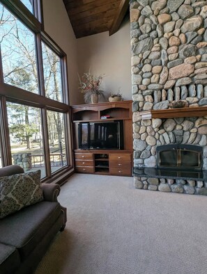 Smart TV, fireplace, table football, books