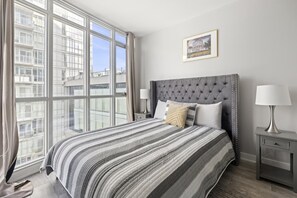 1 bedroom, desk, iron/ironing board, travel crib