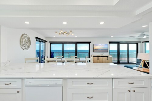 Direct oceanfront 3/2 corner penthouse with huge wrap-around balcony and heated pool