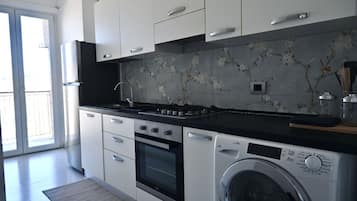 Fridge, oven, dining tables