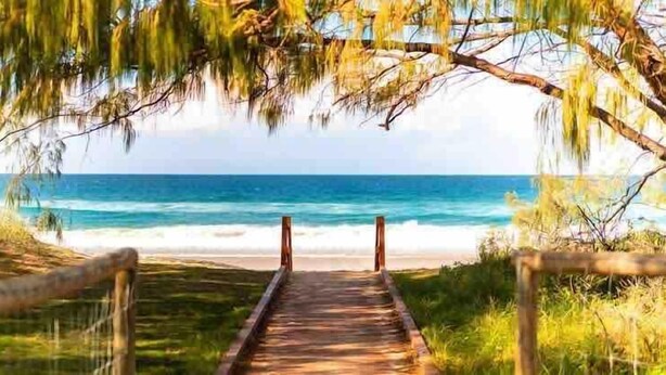 A wooden pathway leading to a beach with a view of the ocean. - Broadbeach Ocean-View Beachfront Apartment (Broadbeach)