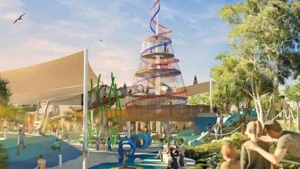 Un espace extérieur moderne agrémenté d’une fontaine en spirale, de coins salon et de verdure.