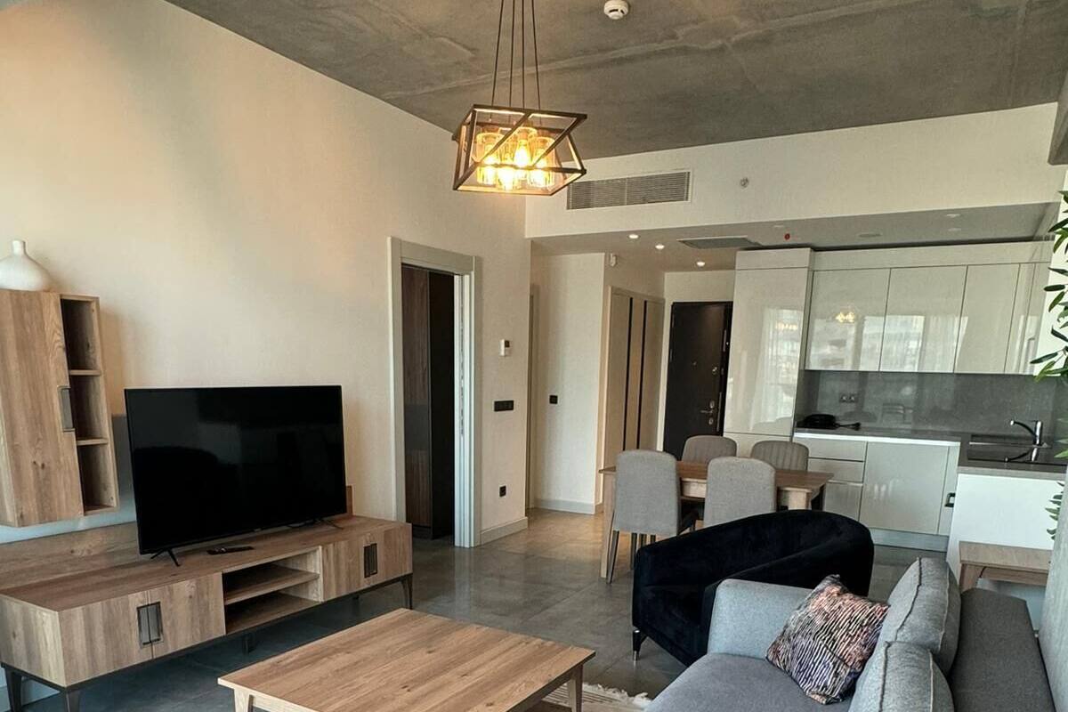 Appartement Deluxe, vue ville | Coin séjour | Télévision de 150 cm avec chaînes par câble