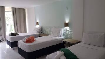 Comfort Triple Room, Partial Sea View | Desk, laptop workspace, free WiFi