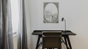 A room with a desk, chair, and a window with curtains. - Outstanding Neubau 3BR w/ Elevator & Laundry, by Blueground (Vienna)