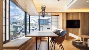 Luxury Quadruple Room | Living area | TV