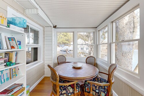 Dog-friendly cabin on the water with a sunroom, firepit, & full kitchen