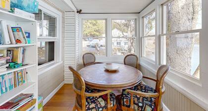 Dog-friendly cabin on the water with a sunroom, firepit, & full kitchen