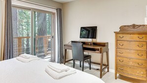 A bedroom with a bed, a desk, a chair, a dresser, and a television. - Forest-View Haven w/ Game Room: Tahoe City Gem! (Tahoe City)