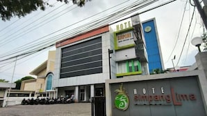 A hotel named "Hotel Simpang Lima" with a prominent sign and a logo. - Hotel Simpang Lima Semarang (South Semarang)