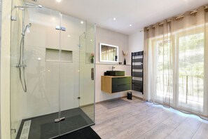 Shower, hair dryer, towels, soap