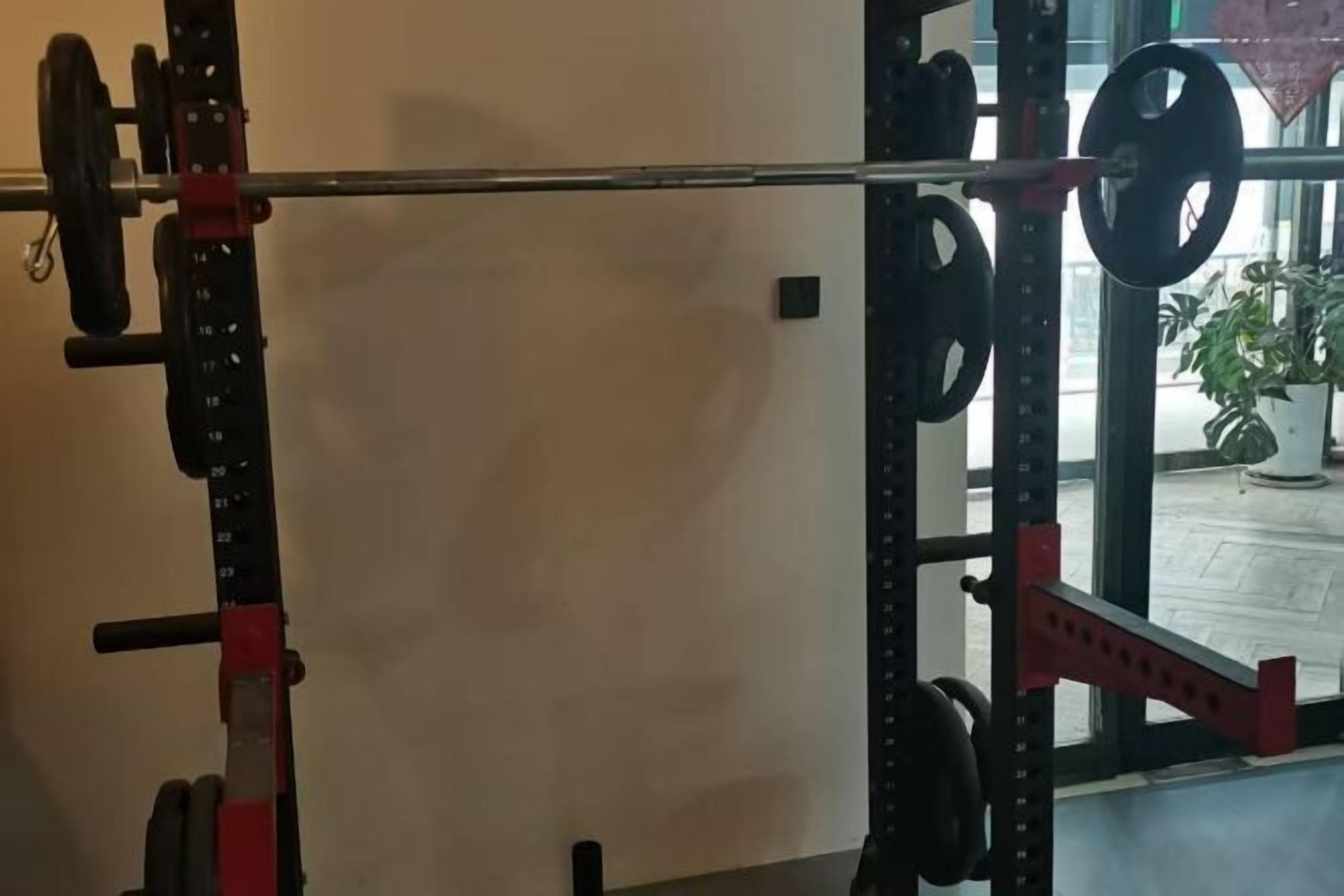 A weightlifting area with a barbell and weight plates.