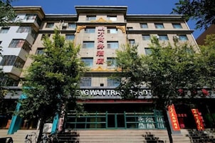 A multi-story hotel with a prominent entrance and signage.