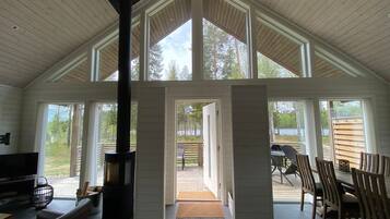 Comfort Cabin, 3 Bedrooms, River View | Living area | 32-inch flat-screen TV with digital channels, TV, fireplace