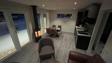 Comfort Cabin, 2 Bedrooms, River View | Living area | 32-inch flat-screen TV with digital channels, TV, fireplace