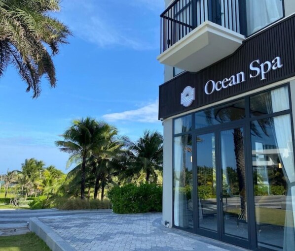 A modern building with a sign reading "Ocean Spa" and large glass windows. - The Sea View Cam Ranh (Bac Cam Ranh)