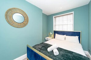 2 dormitorios, tabla de planchar con plancha, wifi gratis y ropa de cama