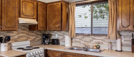 Fridge, microwave, stovetop, coffee/tea maker