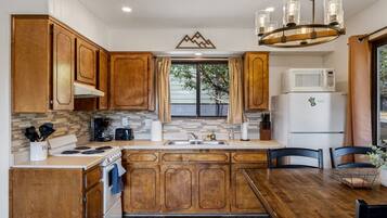 Fridge, microwave, stovetop, coffee/tea maker