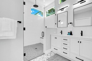 Shower, hair dryer, towels, shampoo