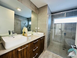Shower, hair dryer, towels, shampoo