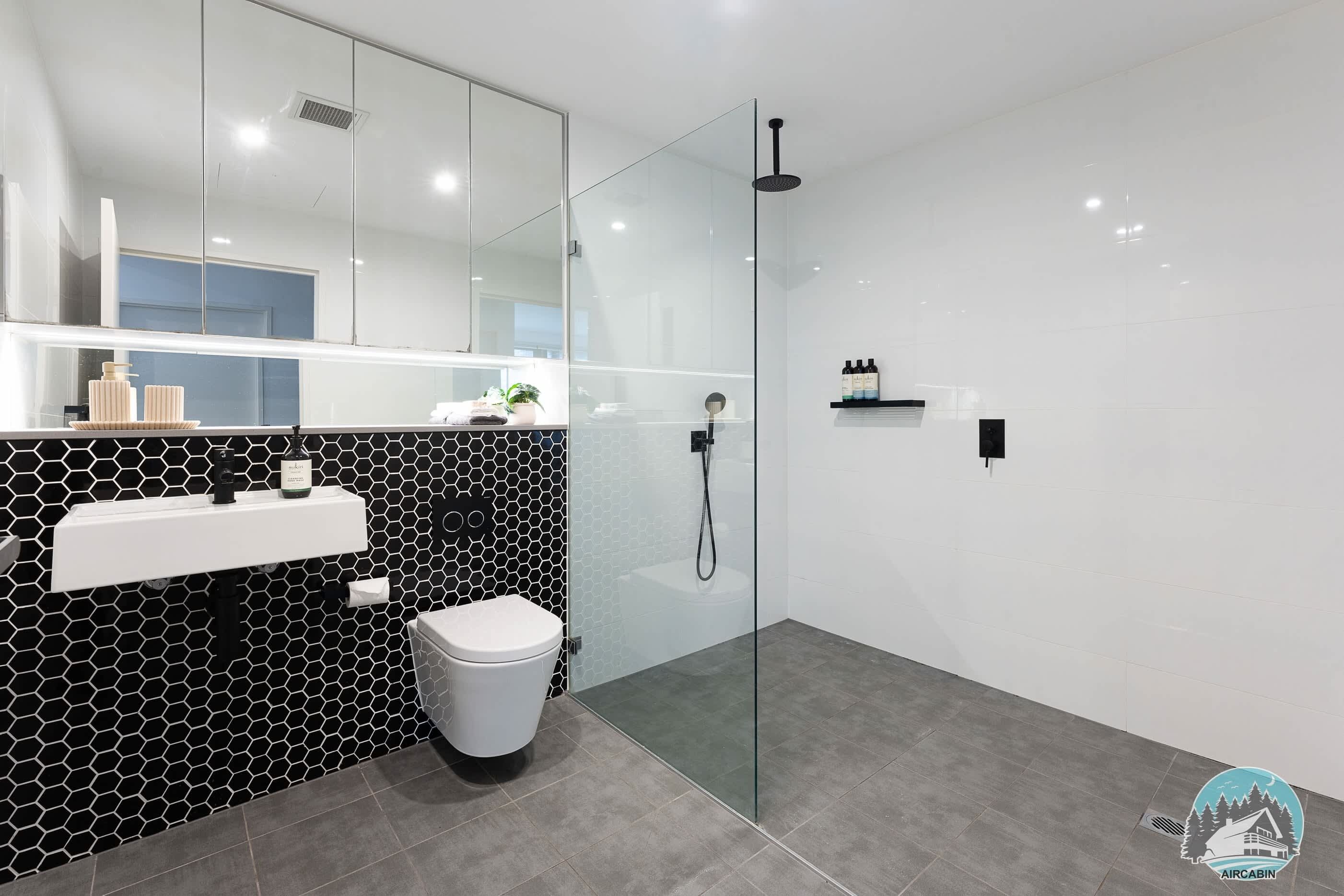 Shower, hair dryer, towels, shampoo