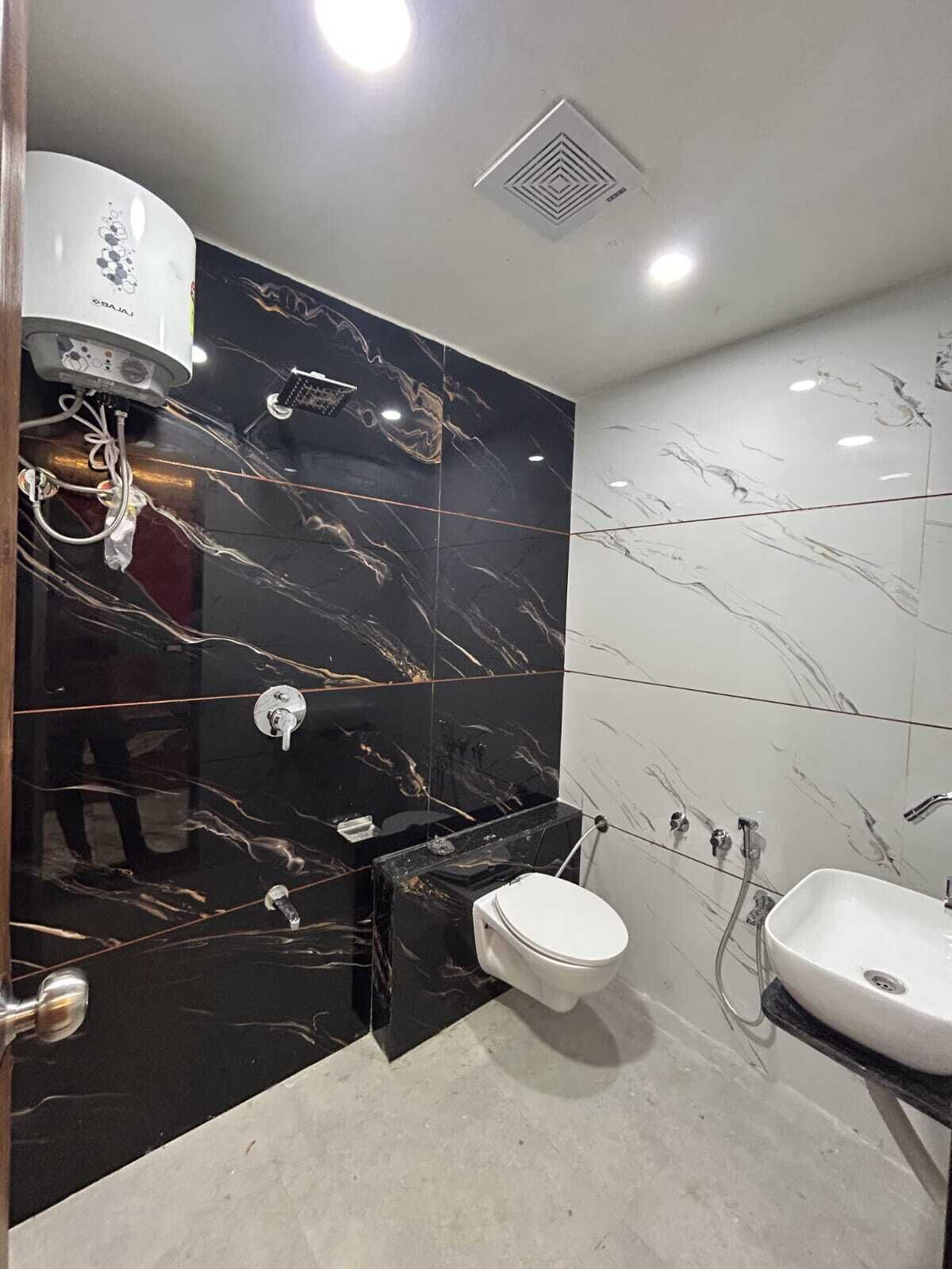 Habitación Deluxe | Baño | Regadera y toallas 