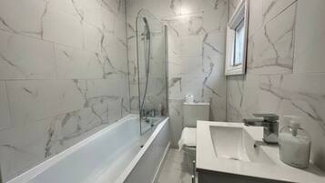 Hair dryer, towels, soap, shampoo