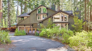A two-story cabin with a wooden deck and a stone pathway leading to the entrance. - Forest-view Haven w/ Game Room: Tahoe City Gem! (Tahoe City)