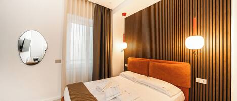 Premium bedding, memory foam beds, in-room safe, desk