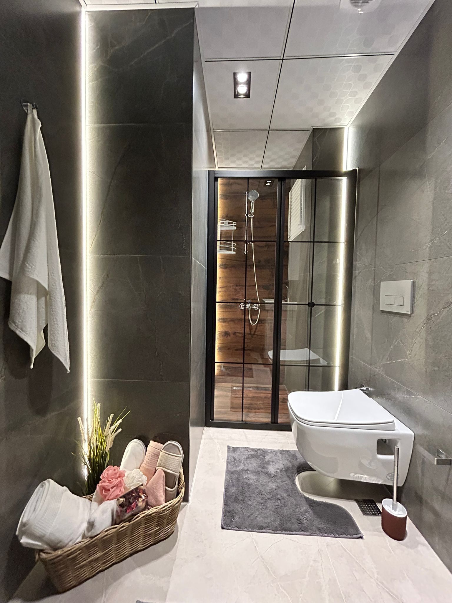 Shower, hair dryer, slippers, towels