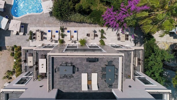 An aerial view of a hotel with a swimming pool, outdoor seating, and lush landscaping. - Moderna Luxury Apartments-One bedroom with terrace 2

 (Tivat)