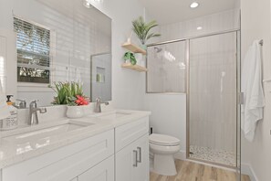 Shower, hair dryer, towels, soap