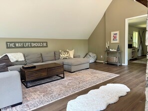 Smart TV, fireplace, books, computer monitors