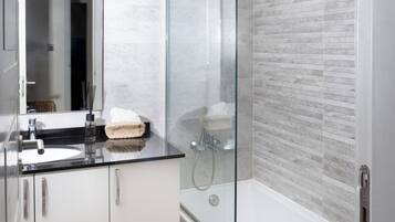 Shower, hair dryer, towels, soap