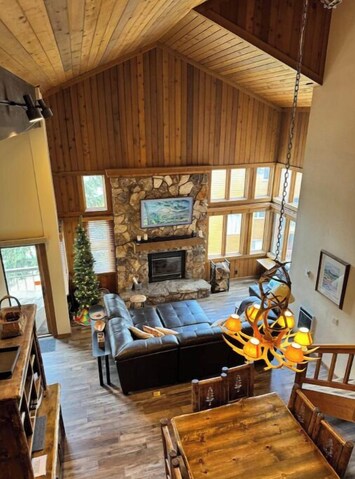 Great room features soaring ceilings and rustic mountain furnishings.