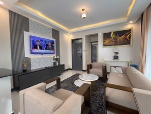 Business Apartment | Living area | TV