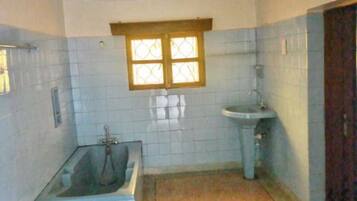 Shower, towels, soap, toilet paper