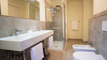 Comfort Room, Garden View | Bathroom | Hair dryer, towels, soap, shampoo