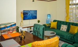 Comfort Apartment, Balcony, City View | Living area | 24-inch Smart TV with satellite channels