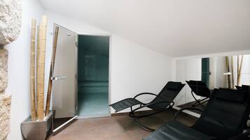 Relax in comfort with a pair of lounge chairs and a soothing ambiance.