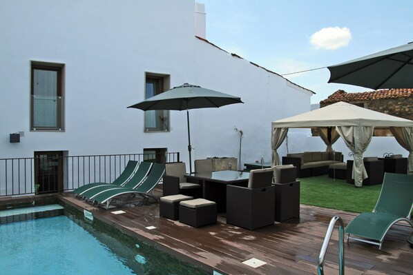 Seasonal outdoor pool, pool umbrellas, pool loungers