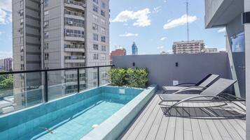 Outdoor pool, open 9:00 AM to 8:00 PM, pool umbrellas, pool loungers