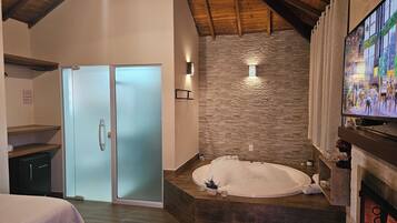 Quarto casal superior | Banheira de hidromassagem particular