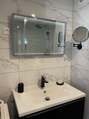 Shower, hair dryer, towels, soap