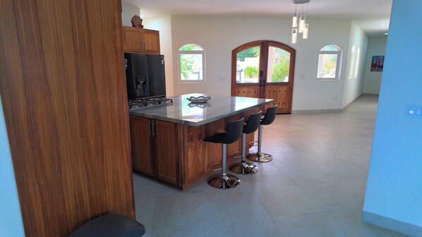 Stovetop, dishwasher, coffee/tea maker, dining tables