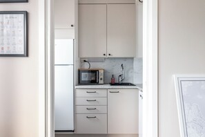 Superior Studio, City View | Private kitchen | Coffee/tea maker, electric kettle, toaster, high chair