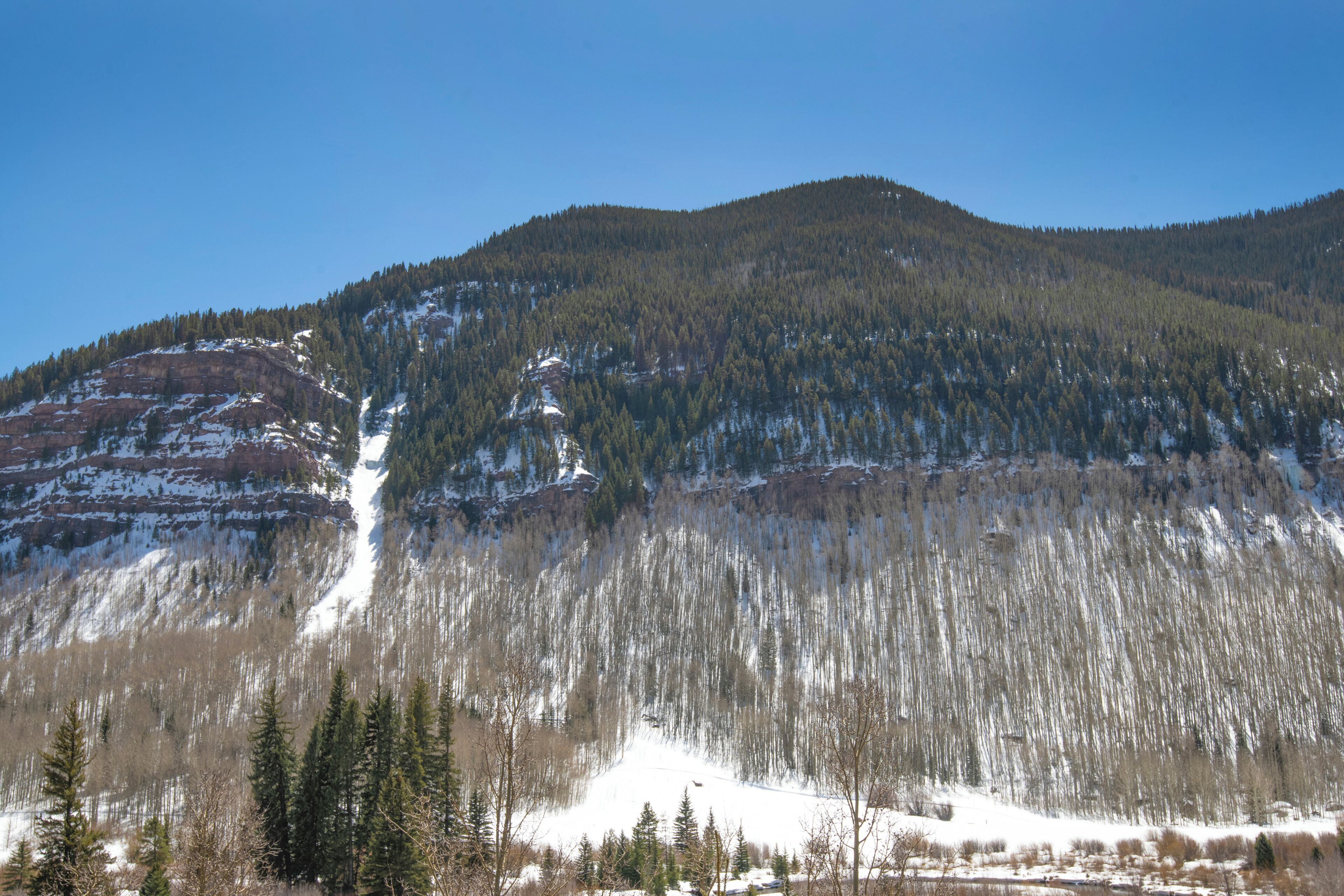 A mountain landscape with a clear sky.