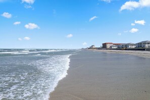 On the beach, sun loungers, beach towels - NSB Direct Ocean View - Cozy 2-bedroom condo with Pool and AC (New Smyrna Beach)